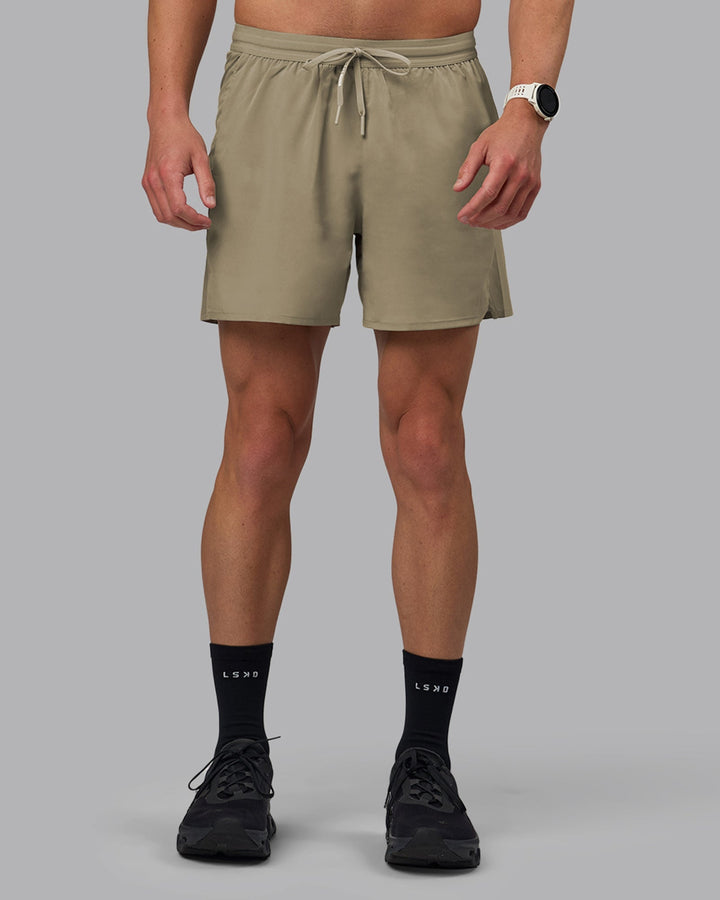 Man wearing Pace 5&quot; Lined Performance Shorts - Elephant
