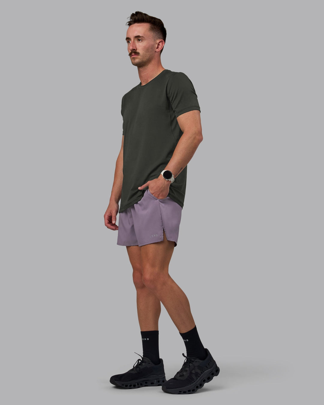 Man wearing Pace 5&quot; Lined Performance Shorts - Purple Sage