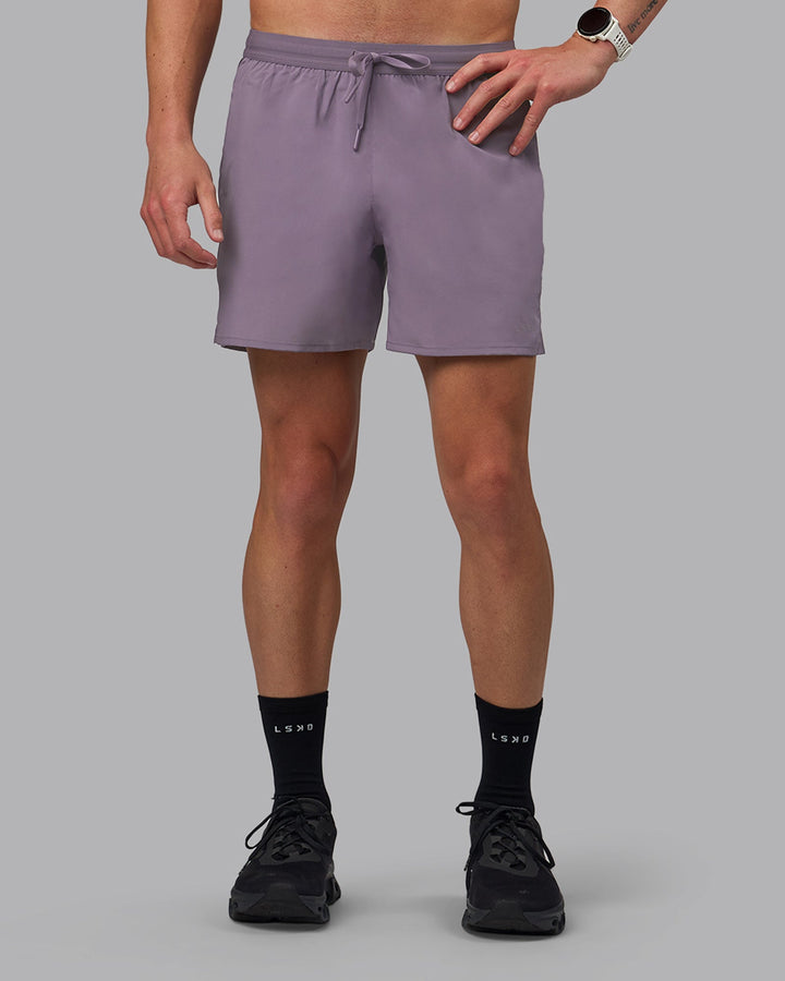 Man wearing Pace 5&quot; Lined Performance Shorts - Purple Sage
