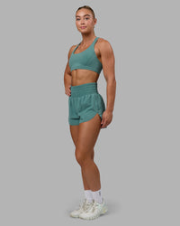 Woman wearing Power Train 2" Shorts - Sagebrush