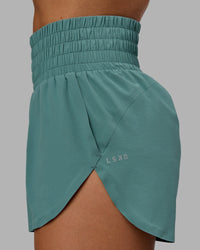 Woman wearing Power Train 2" Shorts - Sagebrush