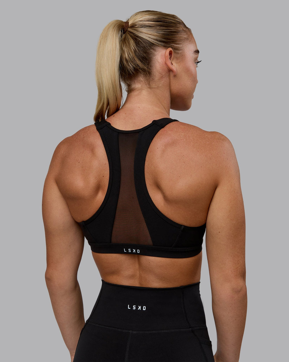 Woman wearing Precision Sports Bra - Black