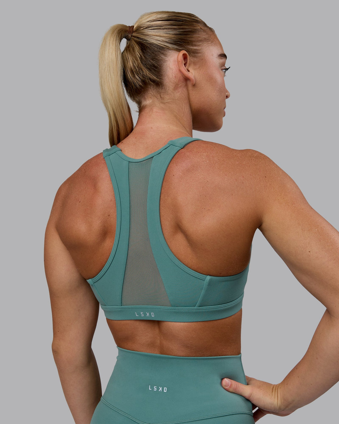 Woman wearing Precision Sports Bra - Sagebrush