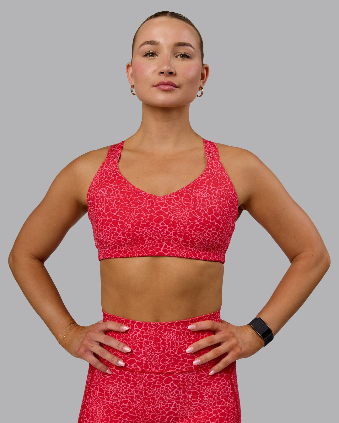 Woman wearing Push The Limit Sports Bra - Red Vitality Print