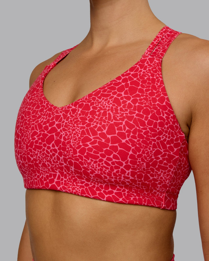 Woman wearing Push The Limit Sports Bra - Red Vitality Print
