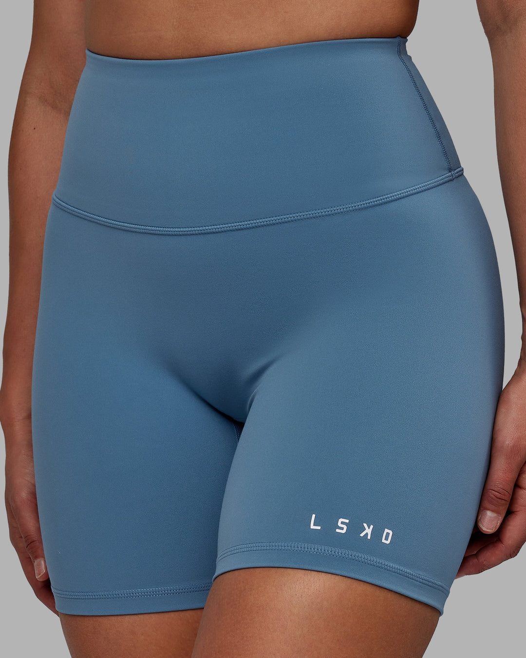 Woman wearing RXD High Waist Mid-Length Shorts - Elemental Blue