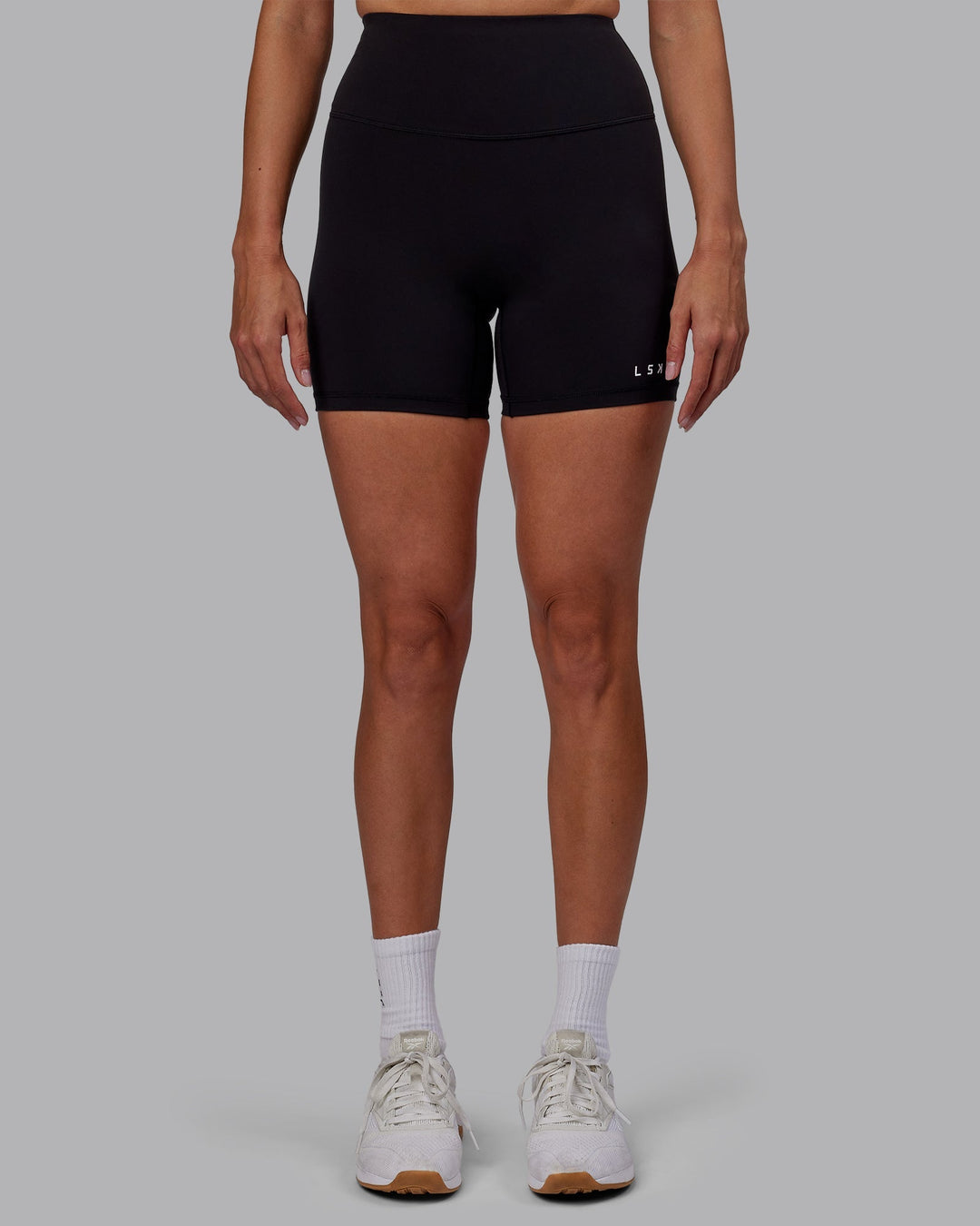 Woman wearing RXD High Waist Mid-Length Shorts - Black