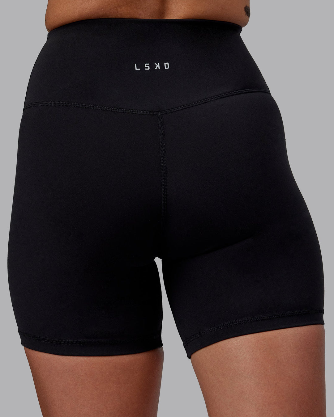 Woman wearing RXD High Waist Mid-Length Shorts - Black