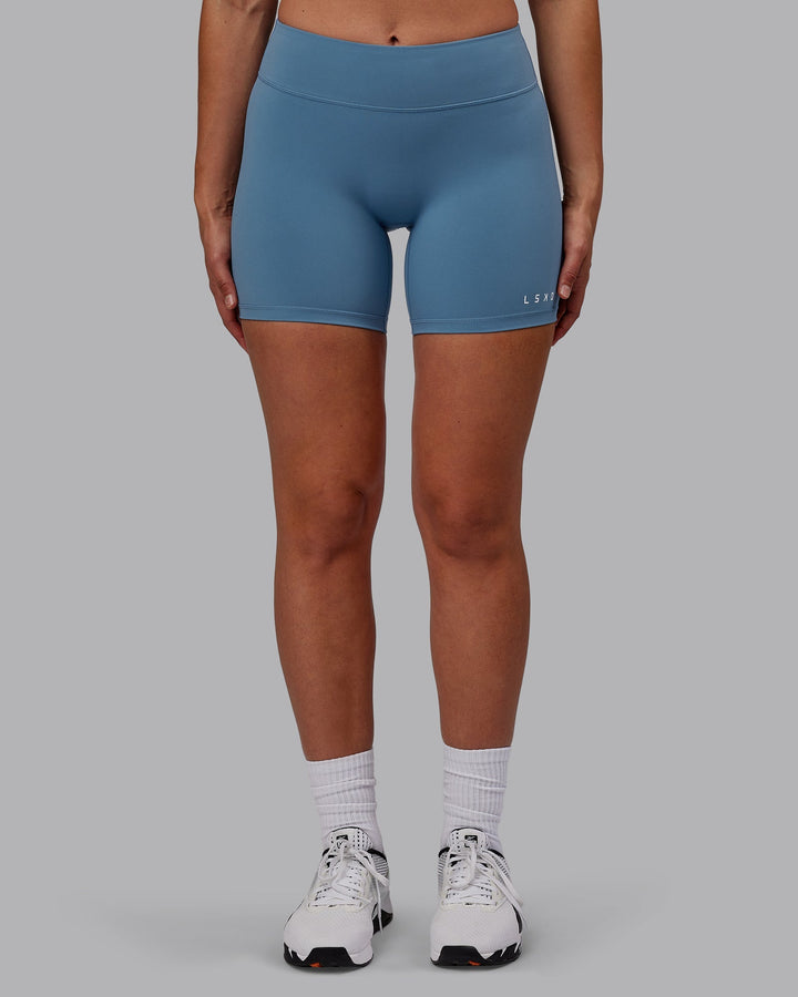 Woman wearing RXD Mid-Length Shorts - Elemental Blue
