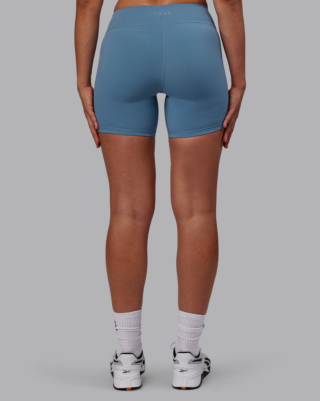 Woman wearing RXD Mid-Length Shorts - Elemental Blue