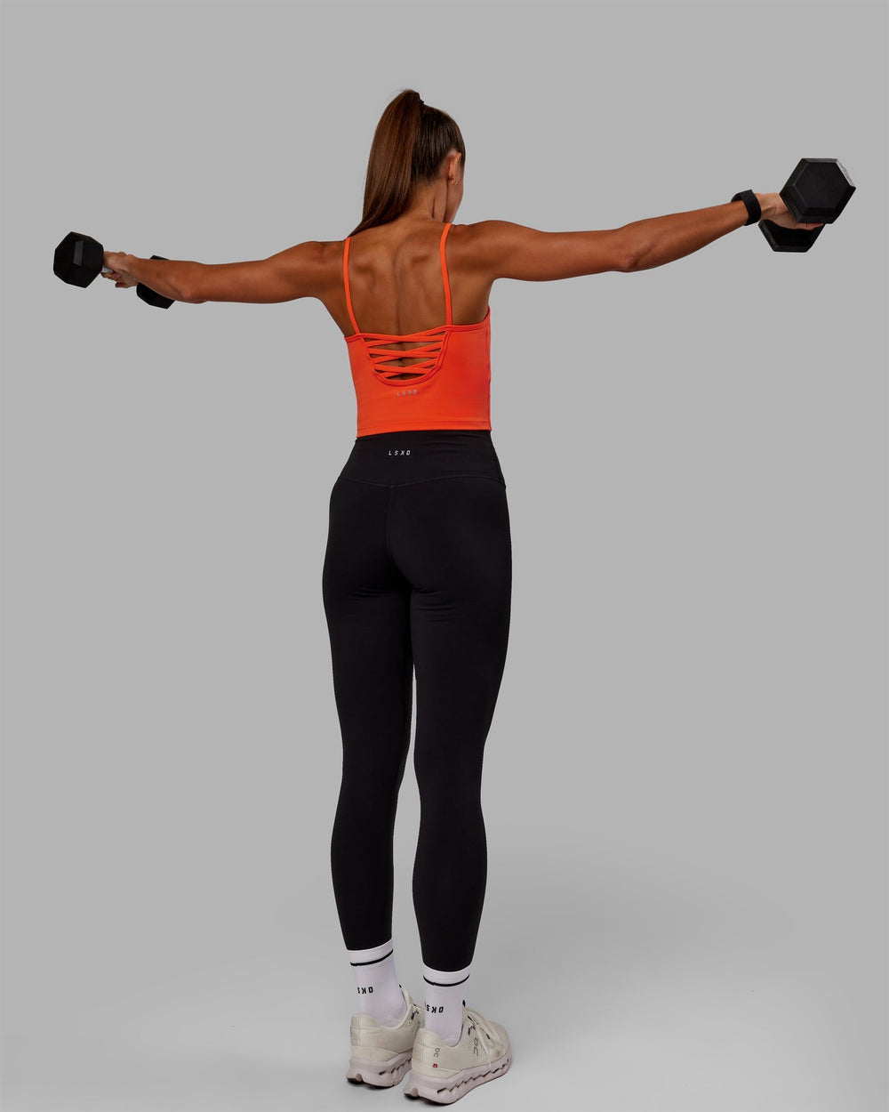 Woman wearing Rapid Active Tank - Ultra Orange