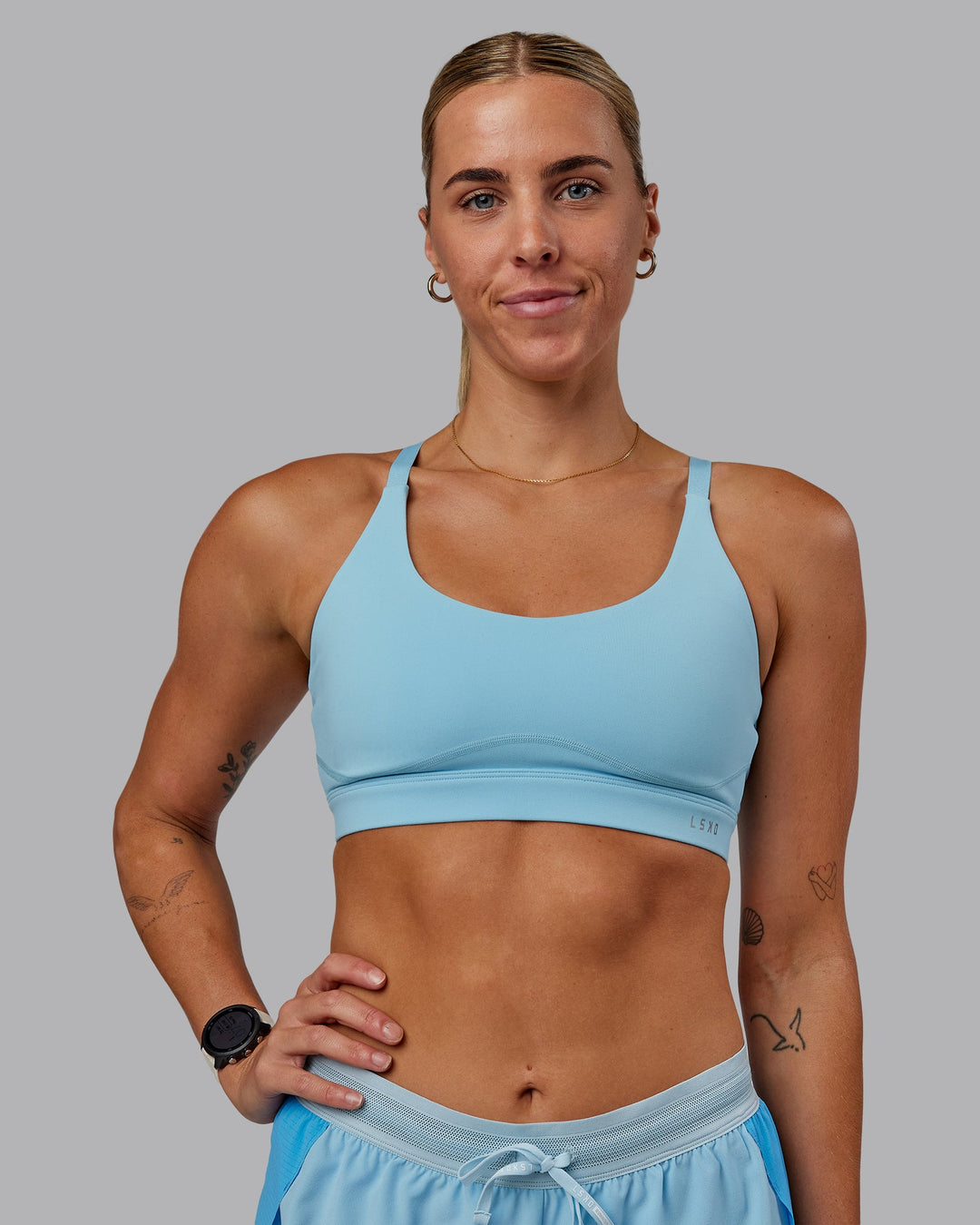 Woman wearing Rapid Sports Bra - Sky Blue