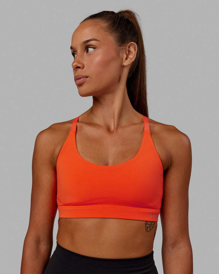 Woman wearing Rapid Sports Bra - Ultra Orange