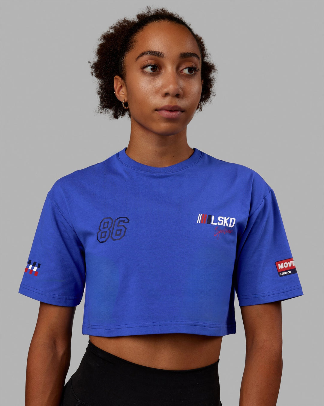 Woman wearing Redline FLXCotton Cropped Tee - Power Cobalt-White