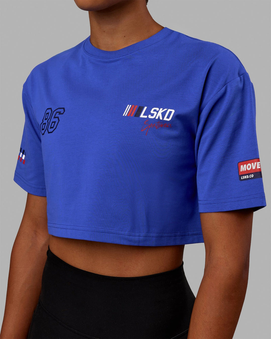Woman wearing Redline FLXCotton Cropped Tee - Power Cobalt-White