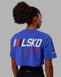 Woman wearing Redline FLXCotton Cropped Tee - Power Cobalt-White