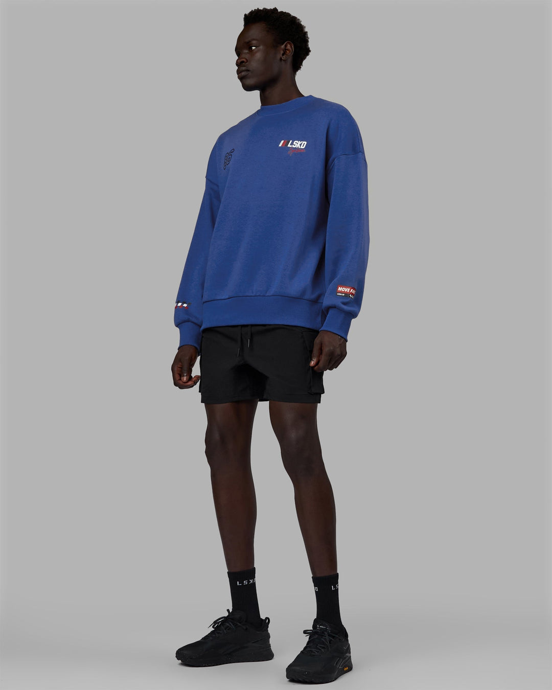 Man wearing Unisex Redline Sweater Oversize - Power Cobalt-White