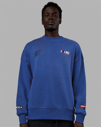 Man wearing Unisex Redline Sweater Oversize - Power Cobalt-White