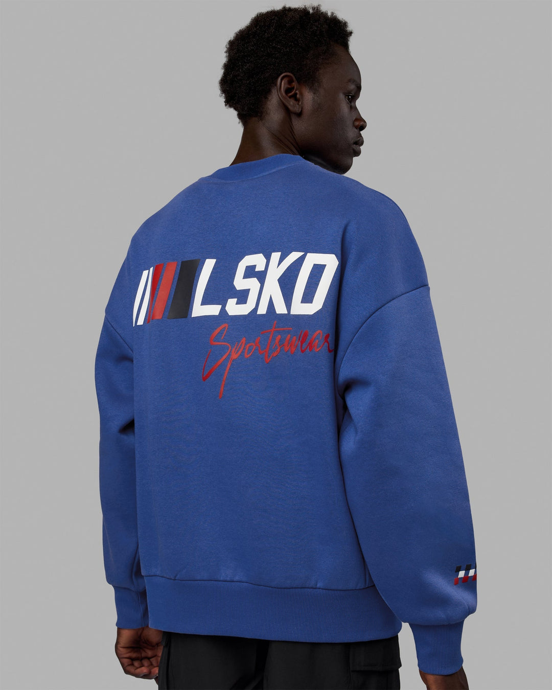 Man wearing Unisex Redline Sweater Oversize - Power Cobalt-White
