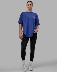 Woman wearing Unisex Redline FLXCotton Tee Oversize - Power Cobalt-White