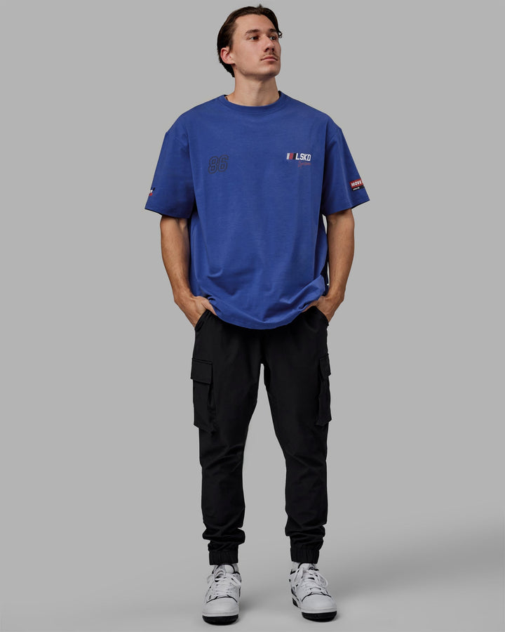 Man wearing Unisex Redline FLXCotton Tee Oversize - Power Cobalt-White
