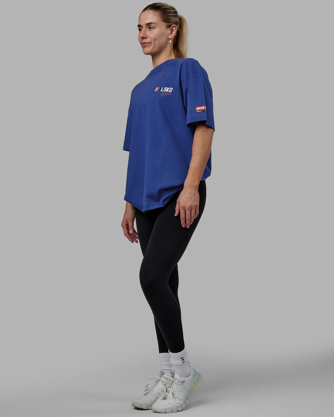 Woman wearing Unisex Redline FLXCotton Tee Oversize - Power Cobalt-White