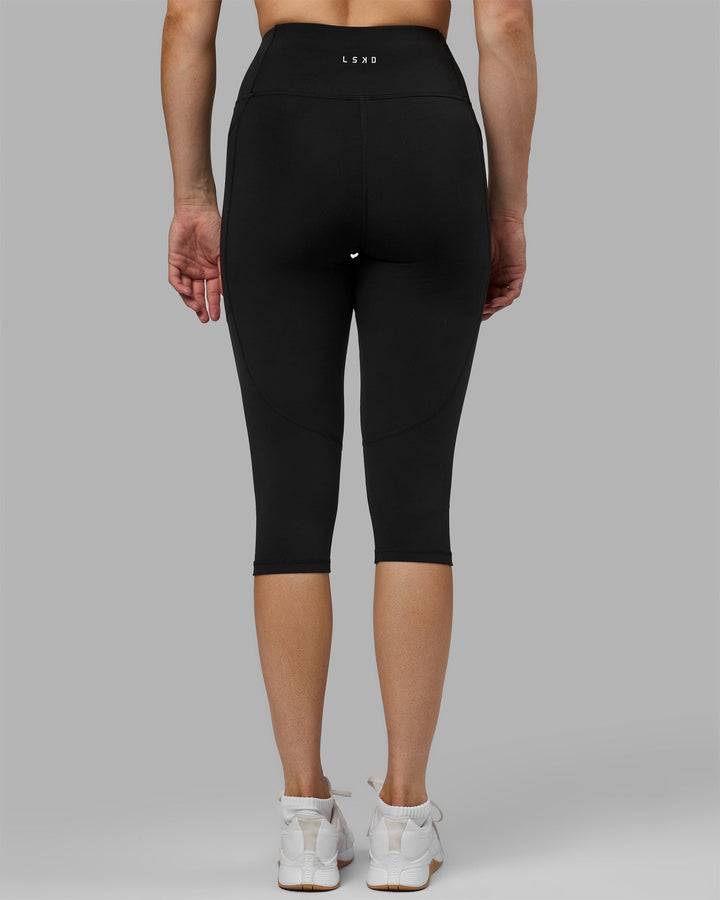 Woman wearing Rep 3/4 Length Leggings - Black-Black
