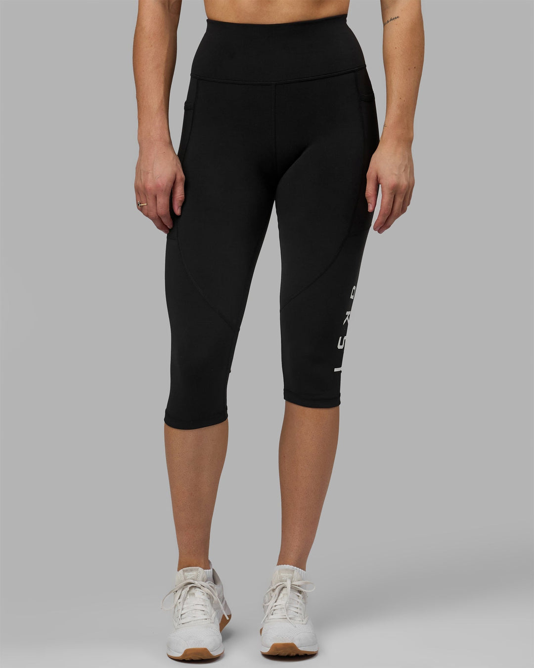 Woman wearing Rep 3/4 Length Leggings - Black-White