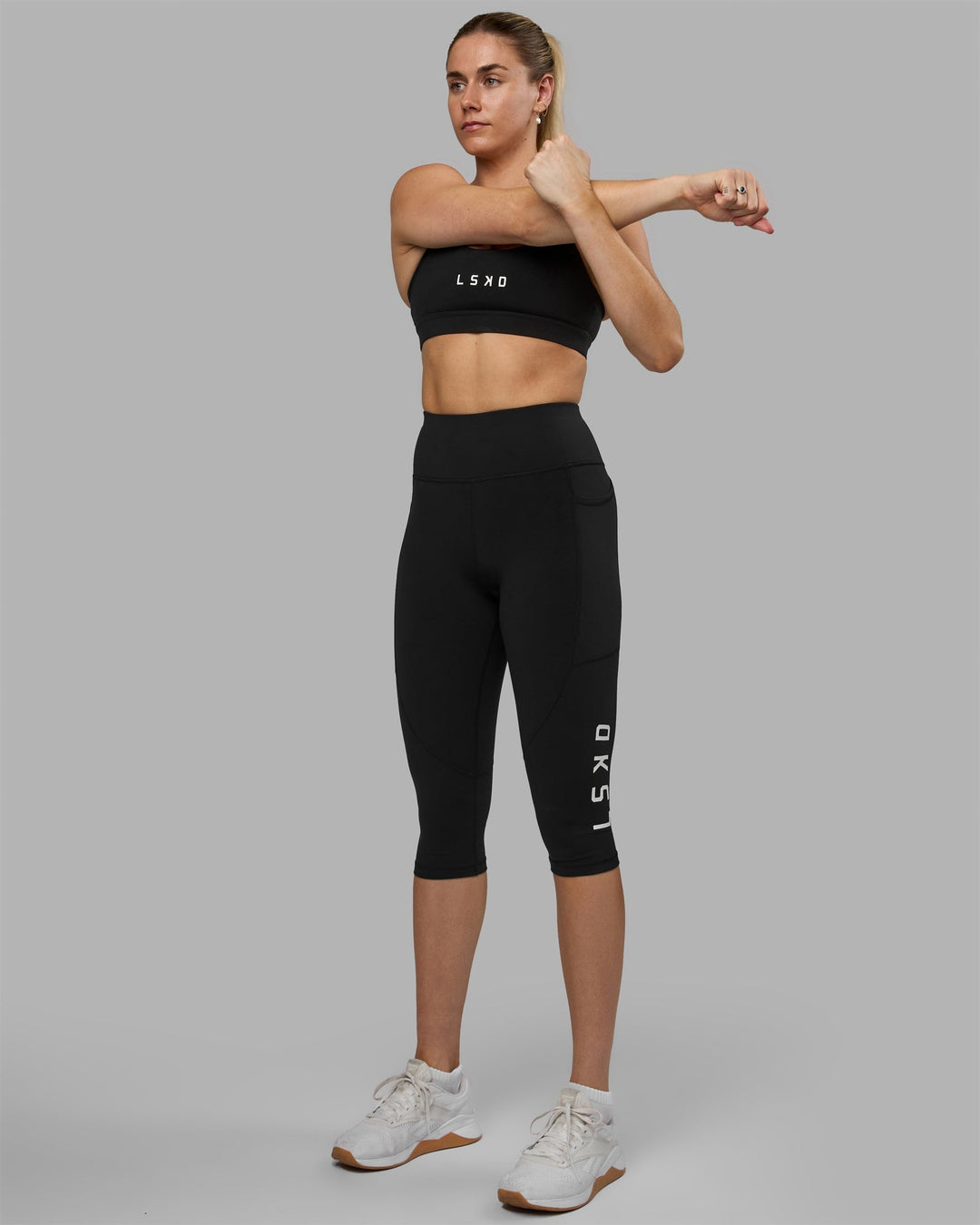 Woman wearing Rep 3/4 Length Leggings - Black-White