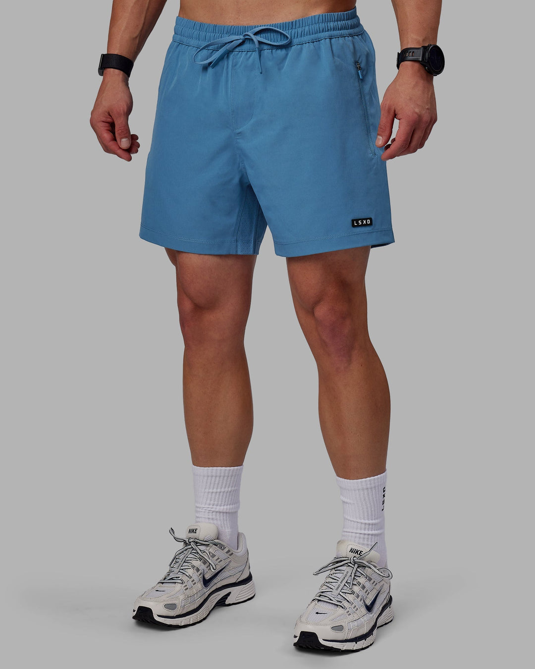 Man wearing Rep 5&quot; Lined Performance Shorts - Elemental Blue