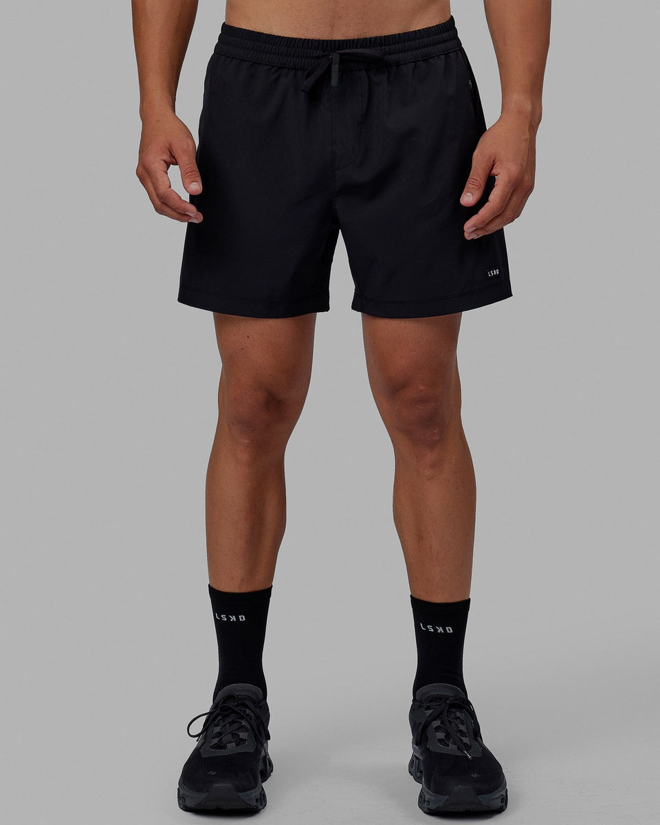 Man wearing Rep 5" Performance Short - Black