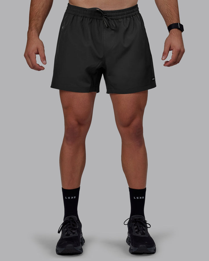 Man wearing Rep 5&quot; Performance Shorts - Pirate Black
