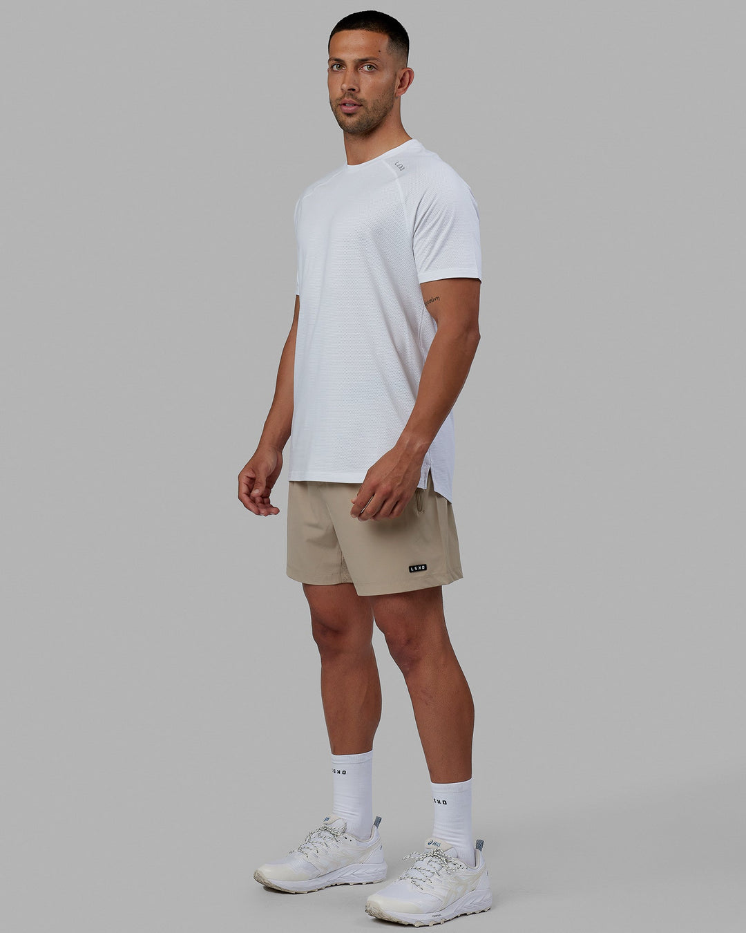 Man wearing Rep 5'' Performance Short - Taupe