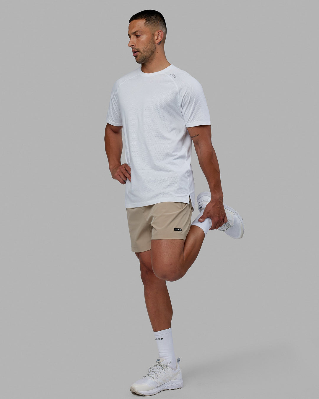 Man wearing Rep 5'' Performance Short - Taupe