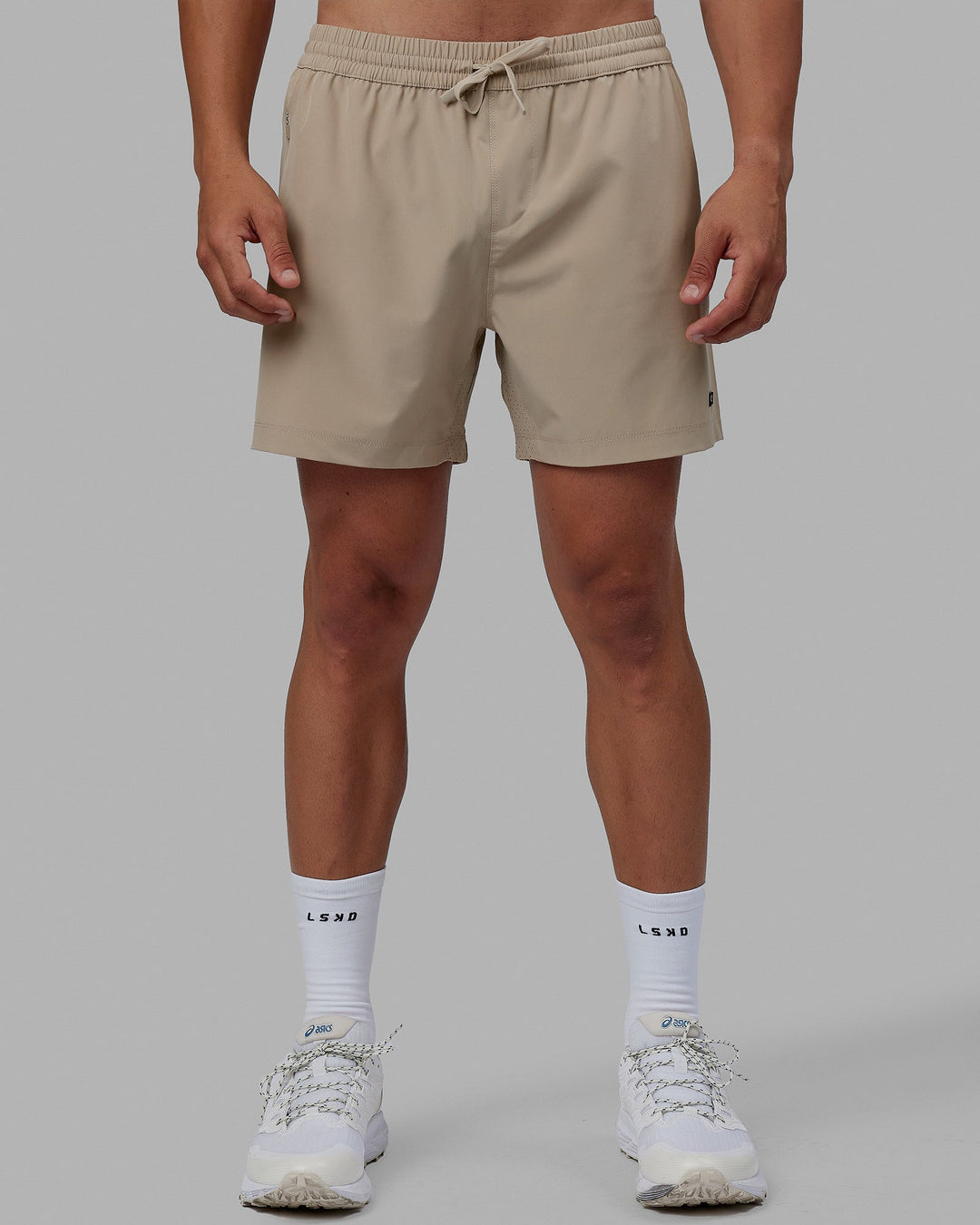 Man wearing Rep 5'' Performance Short - Taupe