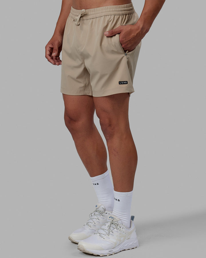 Man wearing Rep 5'' Performance Short - Taupe