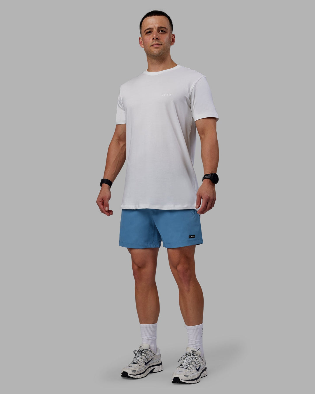 Man wearing Rep 5&quot; Performance Shorts - Elemental Blue