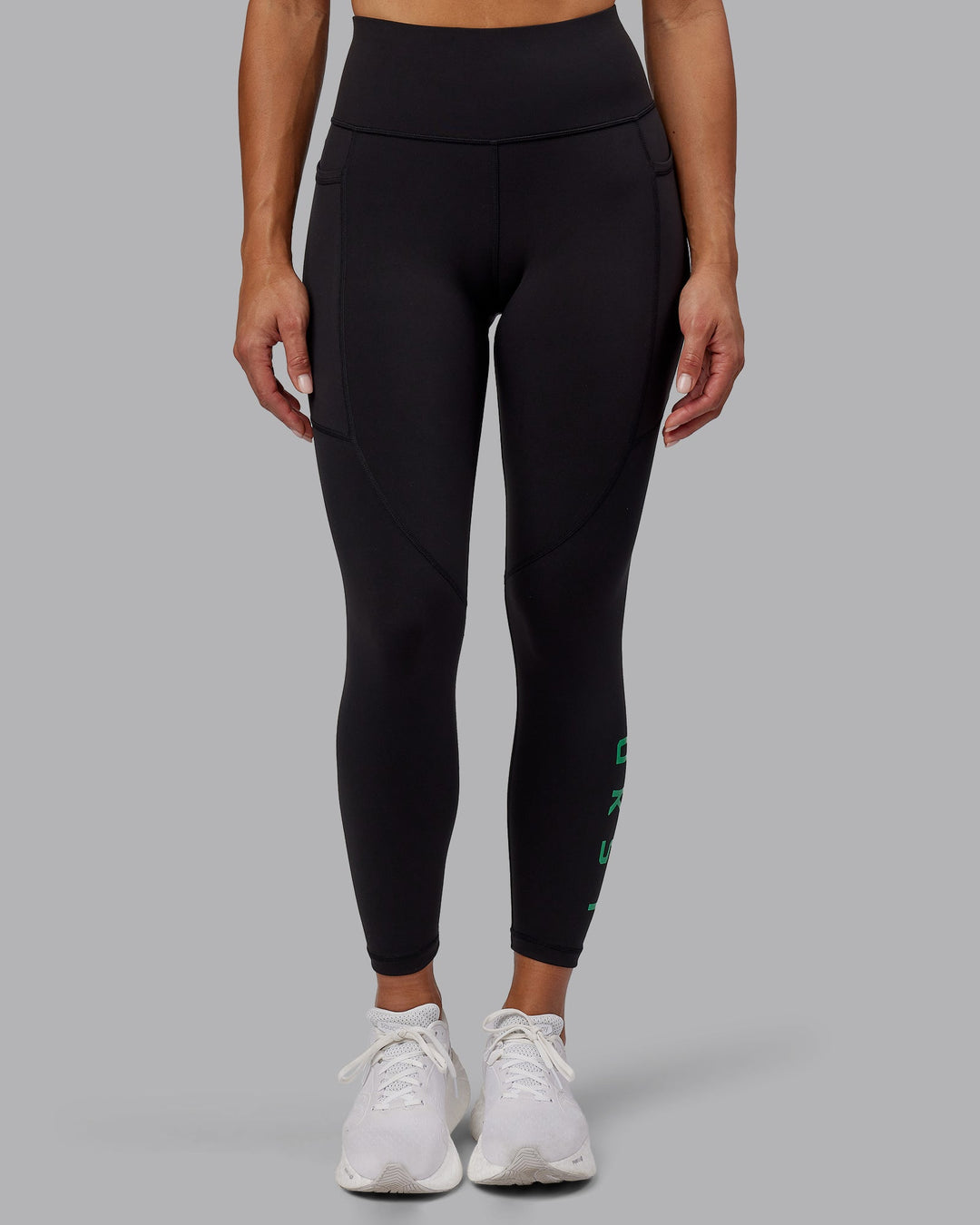 Woman wearing Rep 7/8 Length Leggings - Black-Impact Green