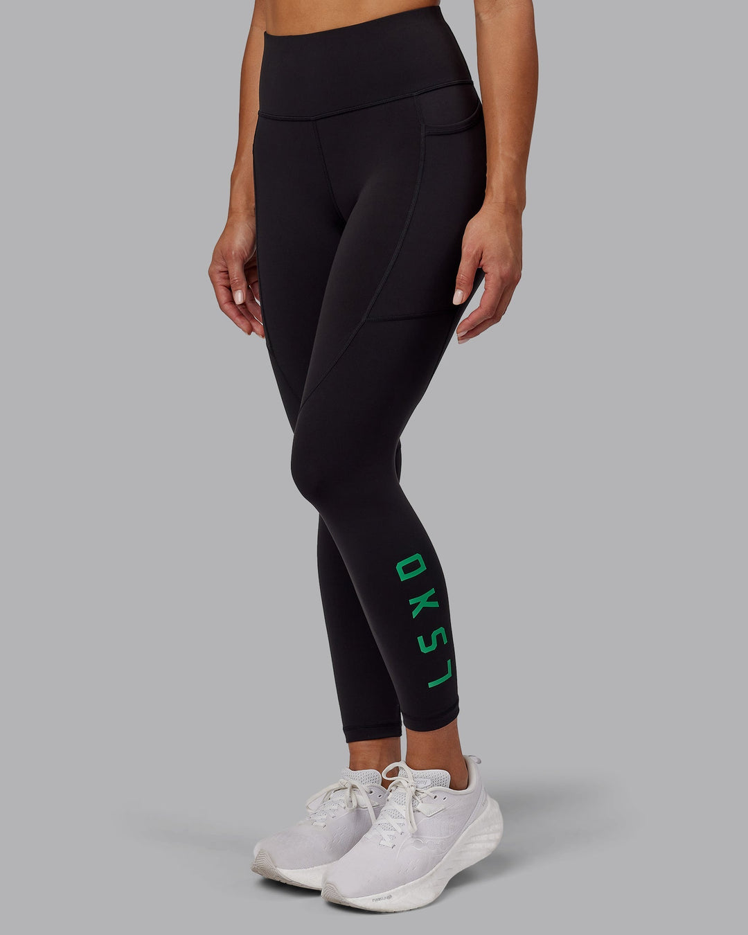 Woman wearing Rep 7/8 Length Leggings - Black-Impact Green