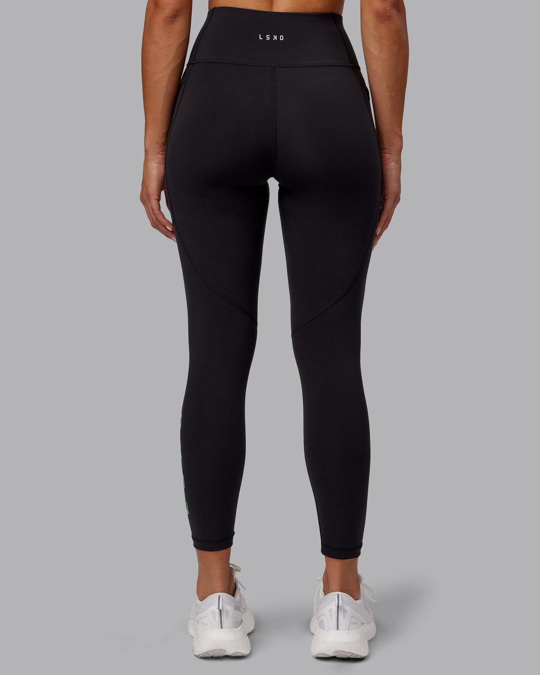 Woman wearing Rep 7/8 Length Leggings - Black-Impact Green