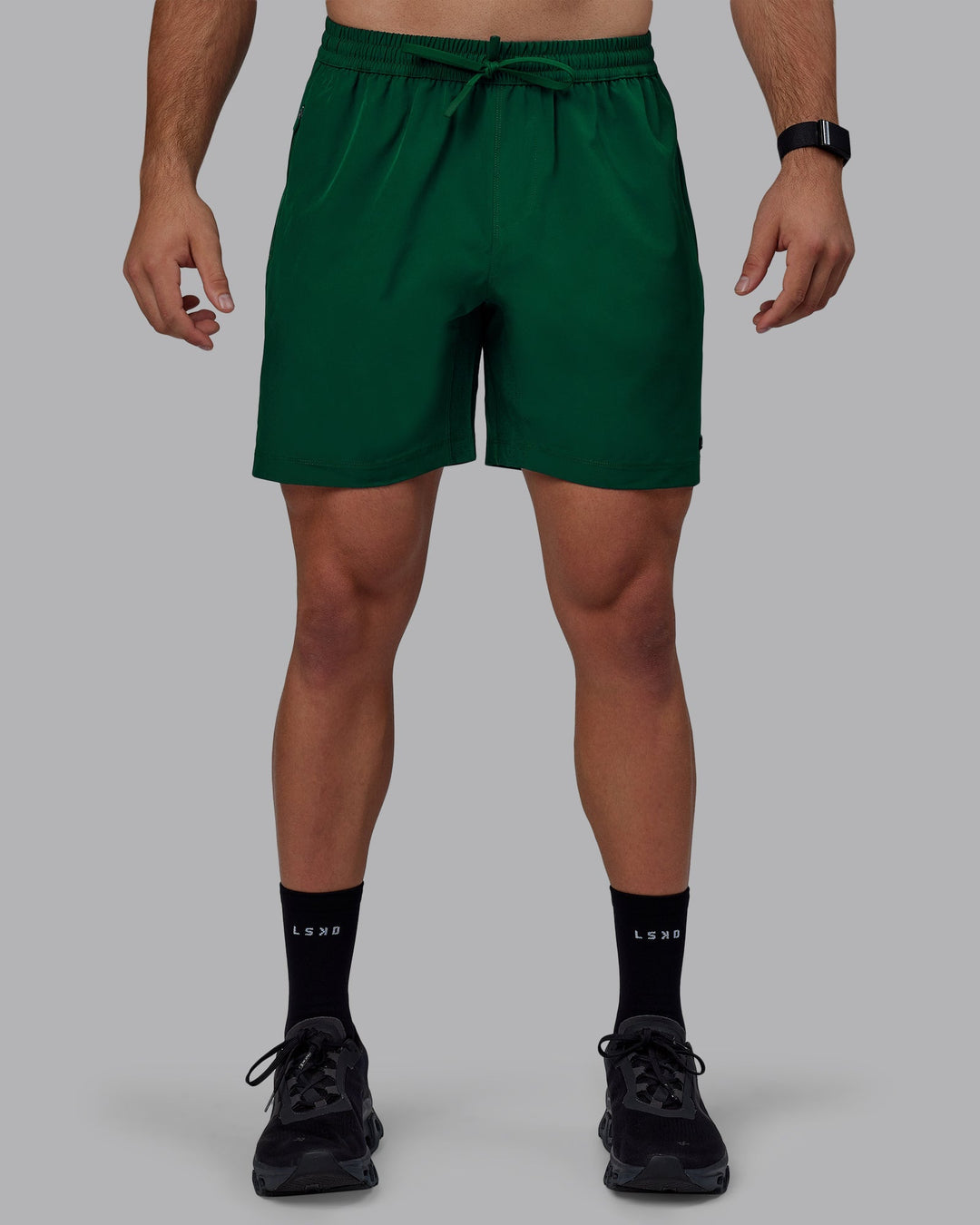 Man wearing Rep 7&quot; Performance Shorts - Deep Emerald