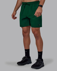 Man wearing Rep 7" Performance Shorts - Deep Emerald