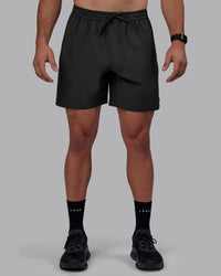 Man wearing Rep 7" Performance Shorts - Pirate Black