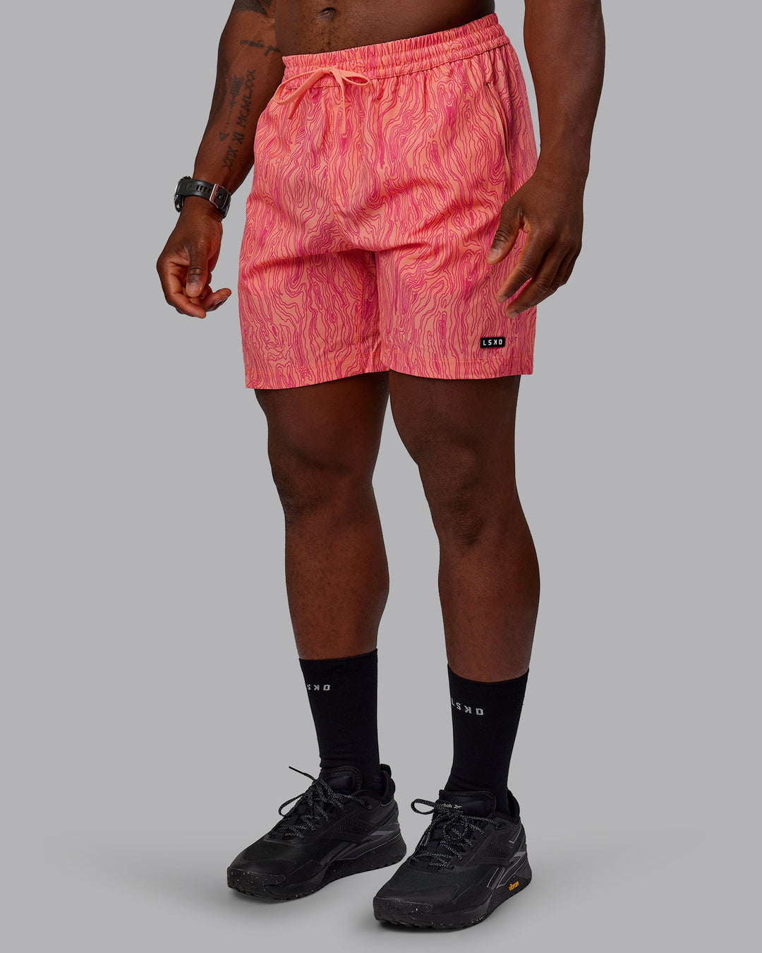 Man wearing Rep 7&quot; Performance Shorts - Topographic Peach