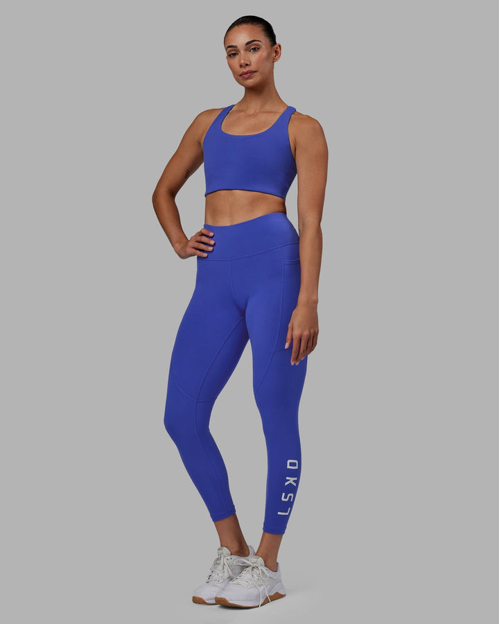 Woman wearing Rep 7/8 Length Leggings - Power Cobalt-White
