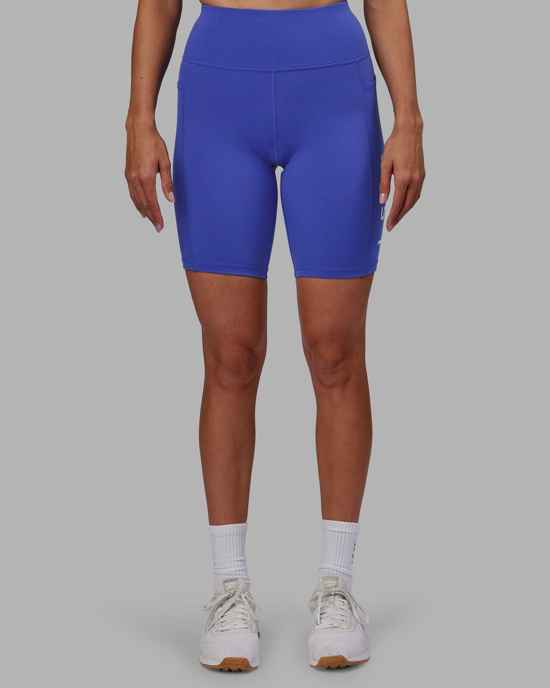 Woman wearing Rep Bike Shorts - Power Cobalt-White