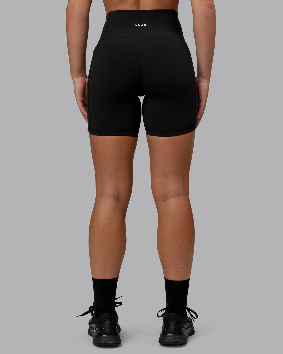 Woman wearing Rep Mid Short Tights - Black-Bubblegum