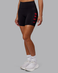 Woman wearing Rep Ultra High-Rise 6" Short Pockets - Black-Scarlet