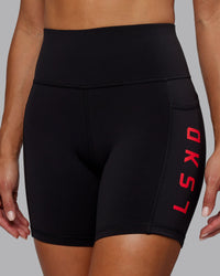 Woman wearing Rep Ultra High-Rise 6" Short Pockets - Black-Scarlet