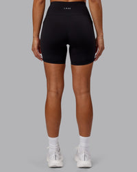 Woman wearing Rep Ultra High-Rise 6" Short Pockets - Black-Scarlet